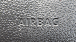 Picture of a car dashboard showing the embossed word airbag